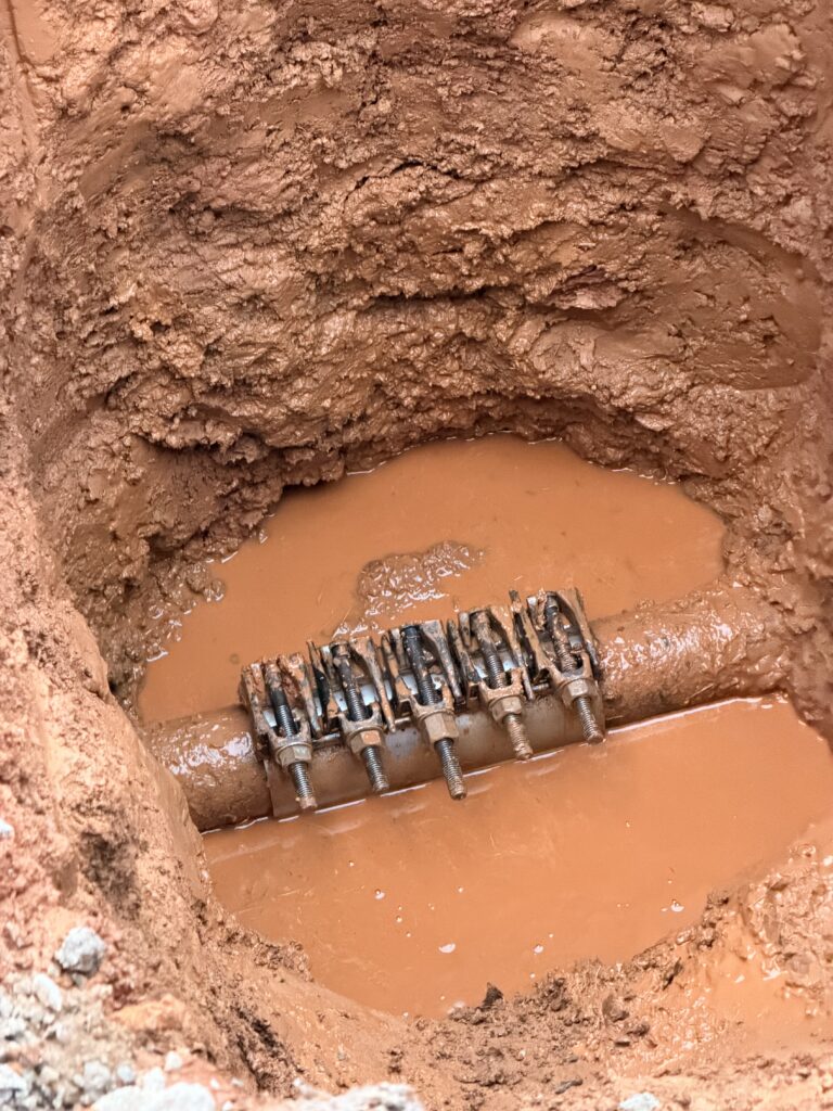 Water pooling in a yard from an underground line break